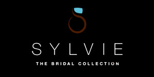 Sylvie - The Sylvie Collection is a bridal line designed to celebrate love. With each style special attention is paid to enhance the c...